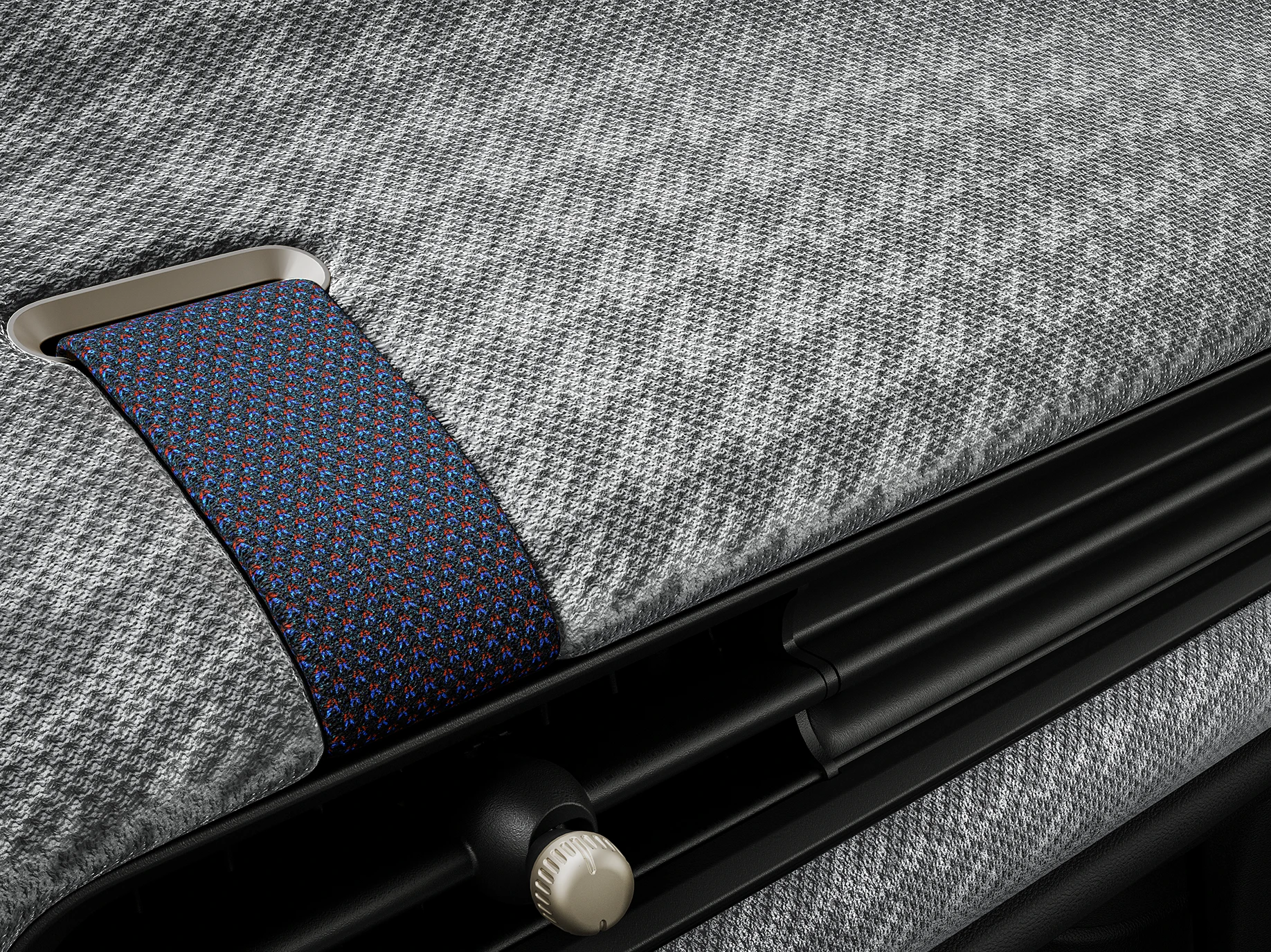 Nahaufnahme des Armaturenbretts eines MINI Cooper mit 2D-Strickbezug.