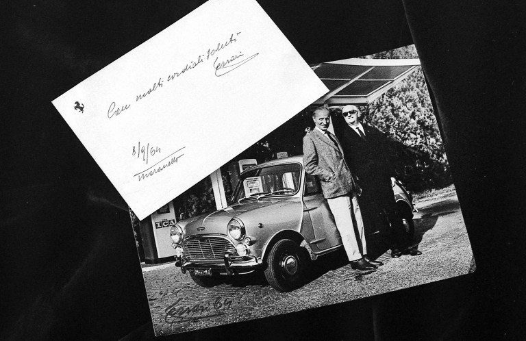 A photo of Alec Issigonis and Enzo Ferrari with a classic Mini and a letter Enzo Ferrari sent to Sir Alec Issigonis.